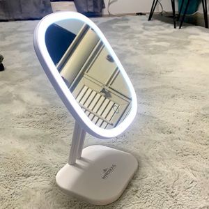 Adjustable, battery powered makeup mirror.